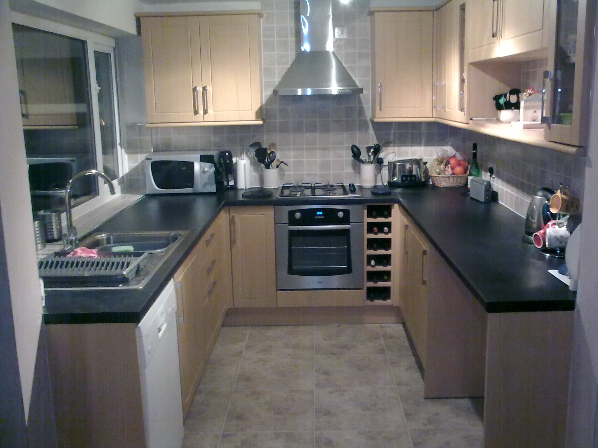 Galley kitchen fitted to dining area, Utility and WC created  in original kitchen space. Electric underfloor heating throughout