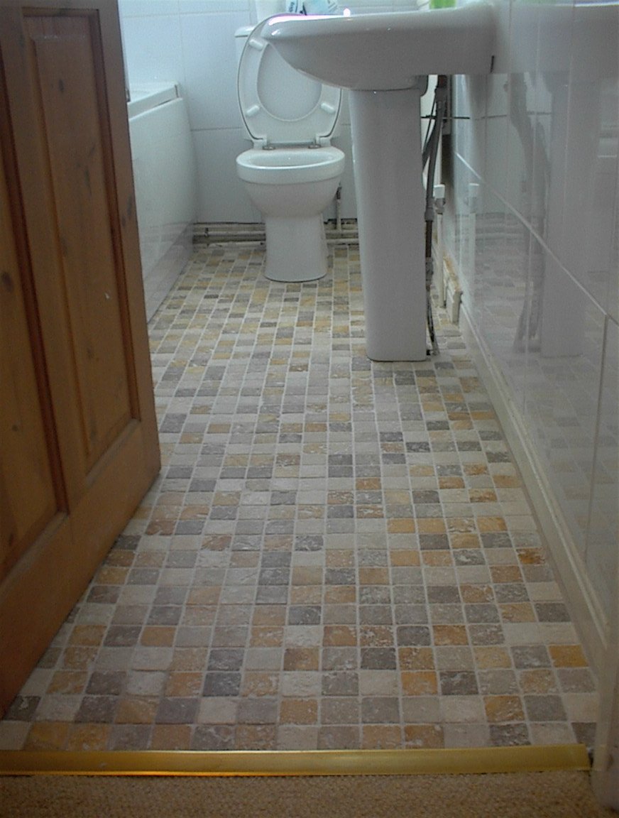 Laminate floor replaced with tiles